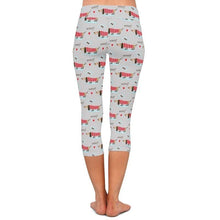 Load image into Gallery viewer, Image of a lady wearing weenie dog leggings