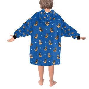 Image of a kid wearing a German shepherd blanket hoodie in blue color with a white background - back view