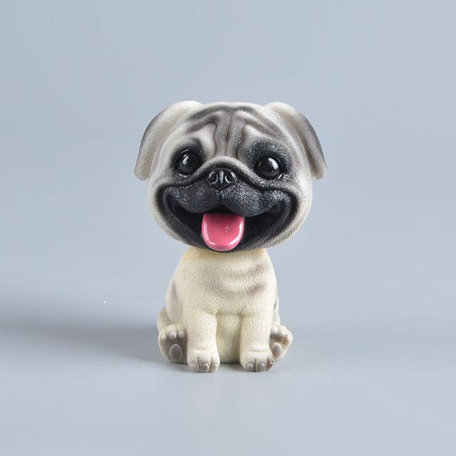 Image of a smiling Pug bobblehead