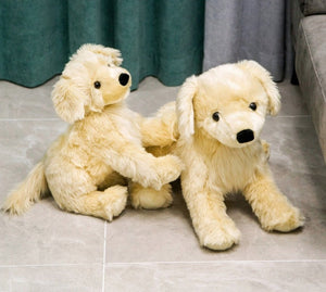 image of adorable golden retriever stuffed animals in different sizes playing with each other