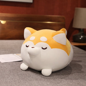 Image of a super cute Shiba Inu stuffed animal plush toy on a bed