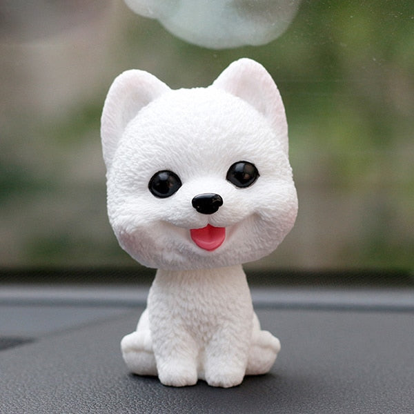 Image of a pomeranian bobblehead in the color white