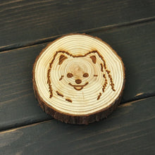 Load image into Gallery viewer, Image of an engraved Pomeranian coaster made of wood