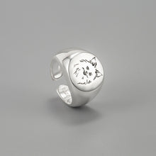 Load image into Gallery viewer, Image of a signet Pomeranian ring in smiling Pomeranian design made of silver