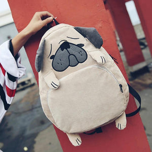 Image of a pug back pack made of corduroy with the cutest pug features, floppy ears and all