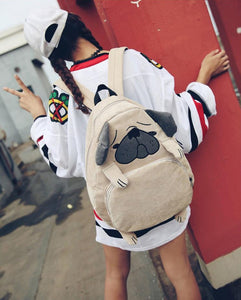 Image of a girl holding Pug backpack