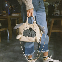 Load image into Gallery viewer, Image of a girl holding pug bag