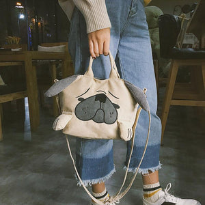 Image of a girl holding pug bag