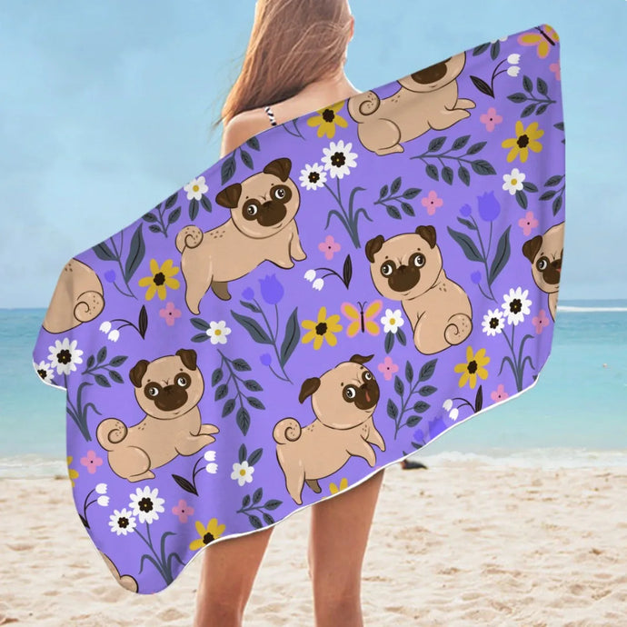 Image of a lady flaunting Pug beach towel at the beach in purple flower garden Pug design