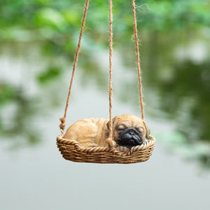 Image of a super cute sleeping and hanging Pug garden statue
