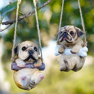 Image of two super cute hanging Pug garden statues