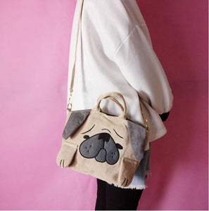 Image of a girl holding pug handbag
