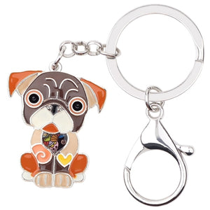 Image of a sitting brown Pug keychain made of enamel