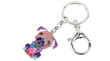 Load image into Gallery viewer, Image of a sitting purple-peach Pug keyring made of enamel