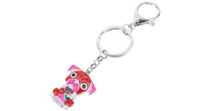Load image into Gallery viewer, Image of a sitting red-pink Pug keyring made of enamel