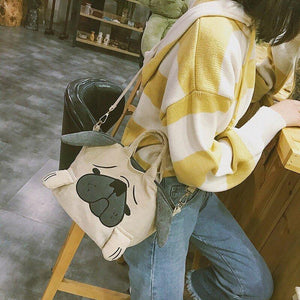 Image of a girl holding pug sling bag