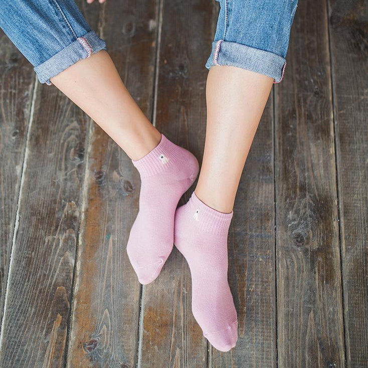 Image of a lady wearing ankle length pug socks womens