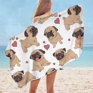 Image of a lady flaunting pug towel in the color white standing on the beach