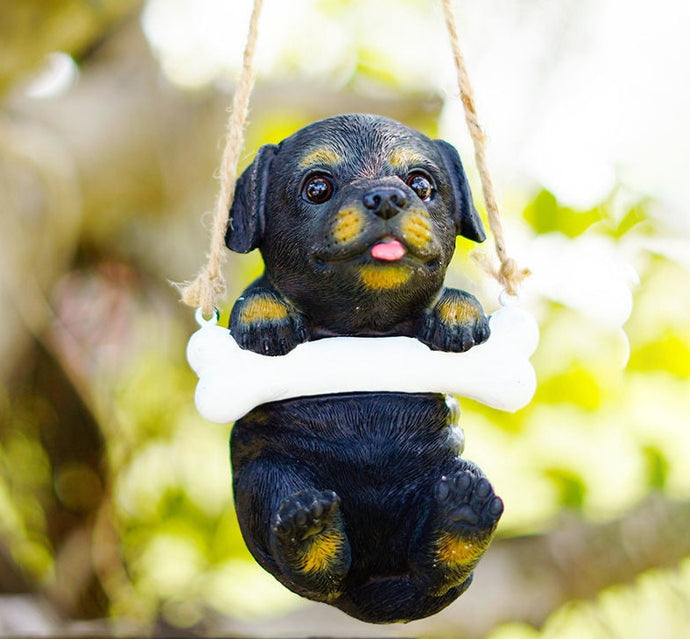 Image of a super cute hanging Rottweiler garden statue