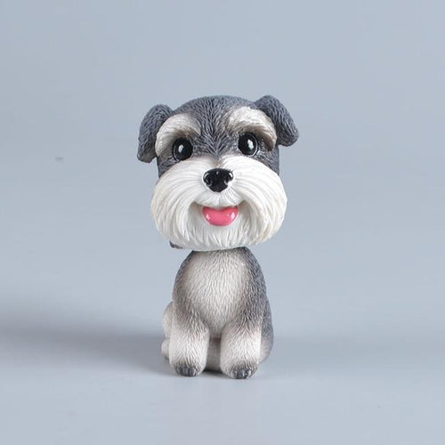 Image of a smiling Schnauzer bobblehead made of Resin