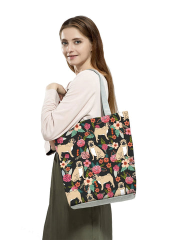 Image of a lady carrying Pug tote bag in a most adorable Pug in bloom design