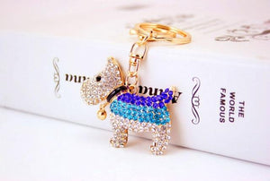 Image of an adorable stone-studded Schnauzer keychain in white  and blue color