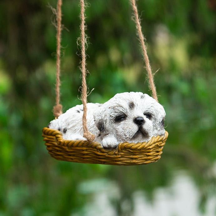 Image of a super cute sleeping and hanging Shih Tzu garden statue