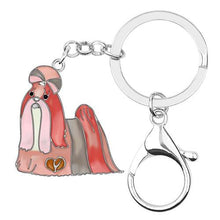 Load image into Gallery viewer, Image of a beautiful pink-peach color enamel long haired Shih Tzu keychain