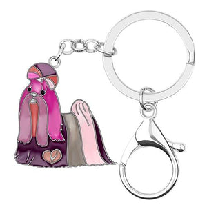 Image of a beautiful purple color enamel long haired Shih Tzu keychain