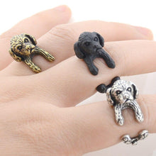 Load image into Gallery viewer, Image of three finger wrap Shih Tzu rings on the finger of a person in three colors including Antique Silver, Bronze, and Black Gunmetal