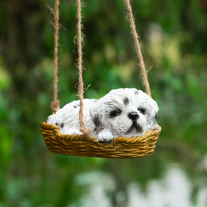 Image of a super cute sleeping and hanging Shih Tzu statue