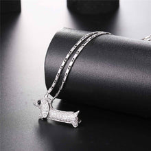 Load image into Gallery viewer, Image of a stone studded dachshund necklace in the color silver