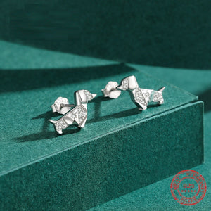 Image of a silver stone studded dachshund earrings jewelry