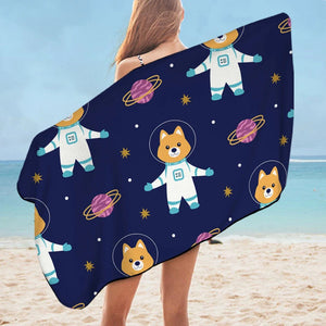 Image of a lady flaunting Shiba Inu beach towel in spaceman Shiba Inu design