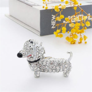 Image of a stone-studded Dachshund keychain in the color white