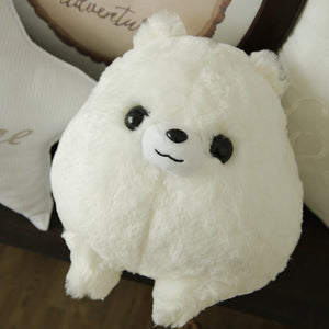 Image of an adorable stuffed American Eskimo Dog plush toy pillow looking up