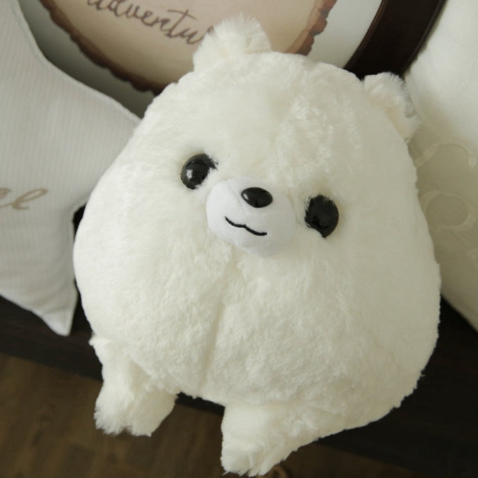 Image of an adorable stuffed American Eskimo Dog plush toy pillow looking up