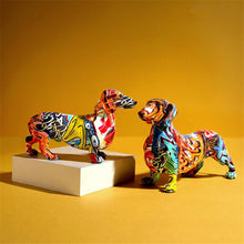 Load image into Gallery viewer, image of two sausage dog statues