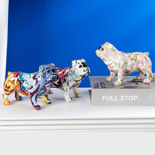 Image of three english bulldog statues in different colors