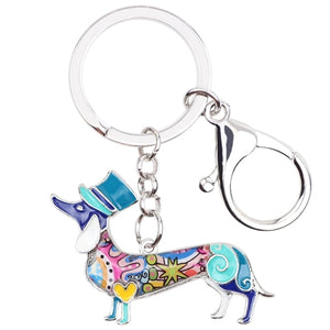 Image of an adorable blue color enamel Dachshund keychain wearing hat, made of enamel