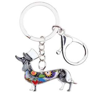 Image of an adorable gray color enamel Dachshund keychain wearing hat, made of enamel