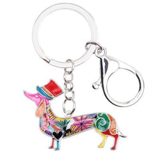 Load image into Gallery viewer, Image of an adorable multicolor enamel Dachshund keychain wearing hat, made of enamel
