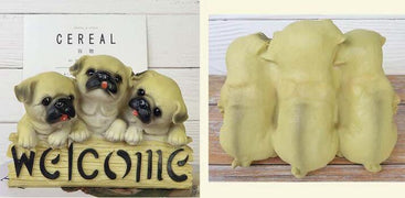 image of three pugs welcome statue - front and back
