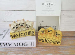 image of a  west highland terrier welcome statue dog welcome statue with books
