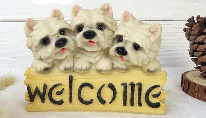 image of three west highland terriers welcome statue