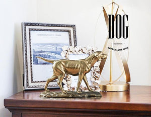 Image of a golden weimaraner dog statue made of brass and resin