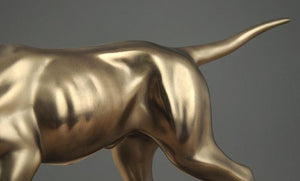Close image of a golden weimaraner statue made of brass and resin