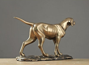 Side image of a golden weimaraner statue made of brass and resin