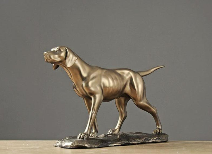 Image of a golden weimaraner statue made of brass and resin