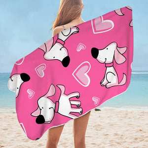Image of a lady with a pink labrador beach towel